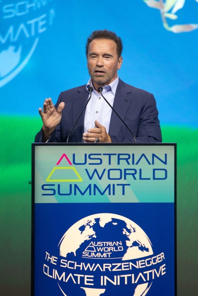 At a podium for the Austrian World Summit