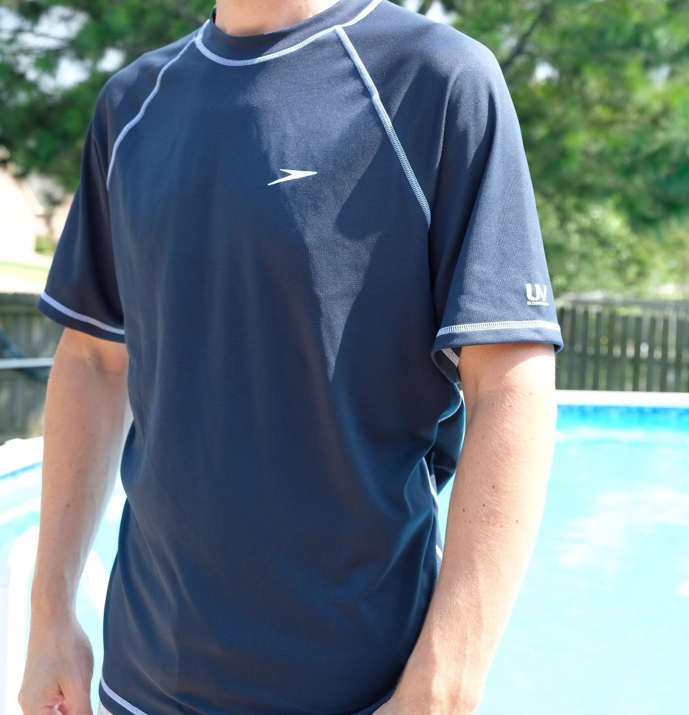 A reviewer wears the shirt in blue