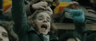 Gif of Hermione Granger cheering in a Harry Potter movie