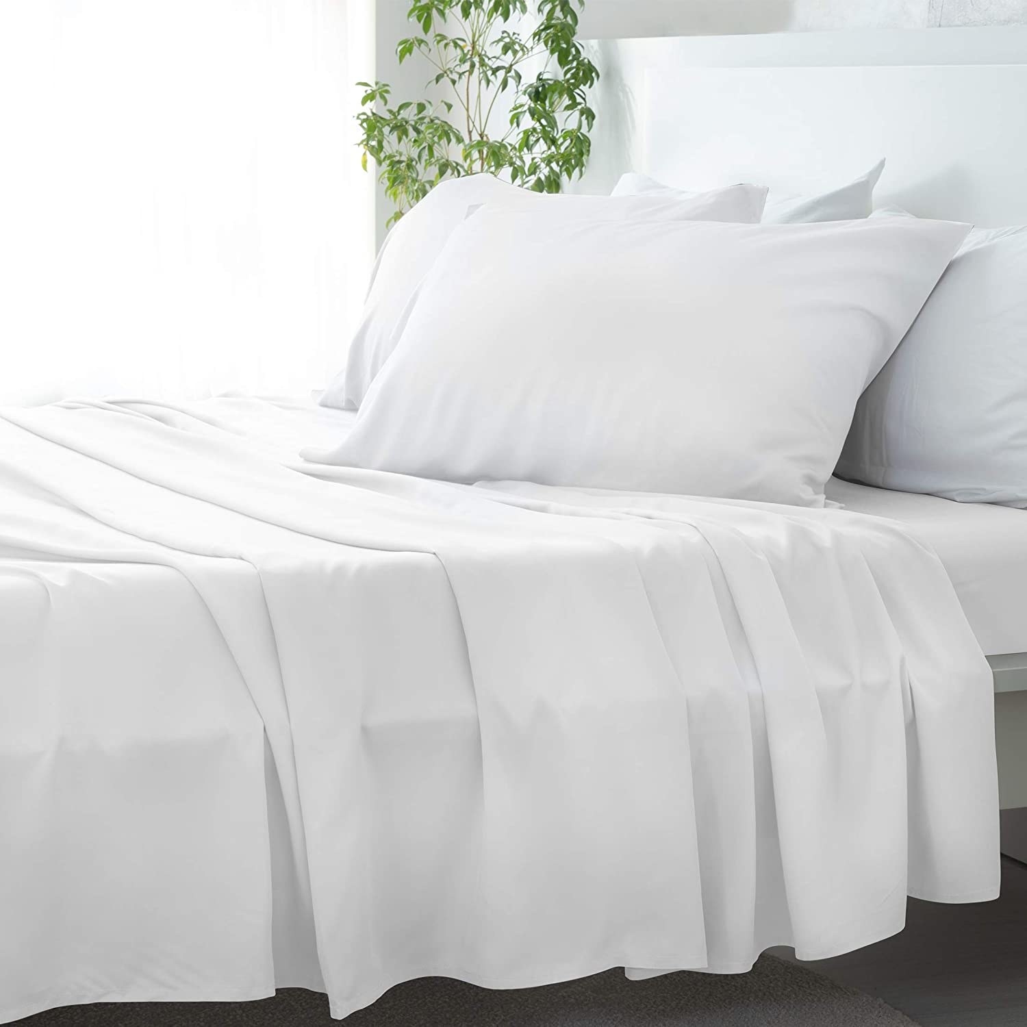 the white david's home bamboo sheets on a bed