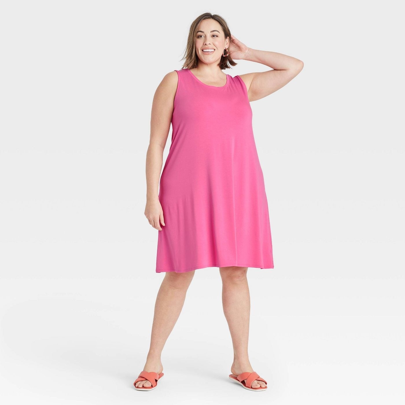 A model wearing a pink sleeveless knit dress
