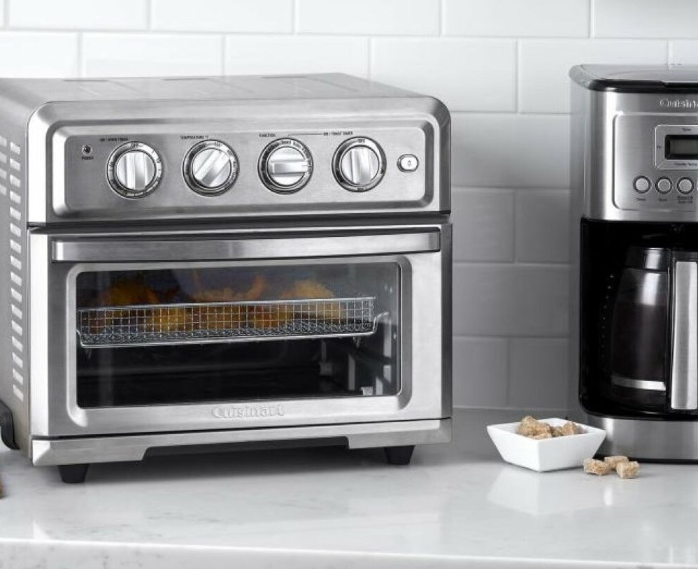 Stainless steel Cuisinart air fryer toaster oven with chicken inside