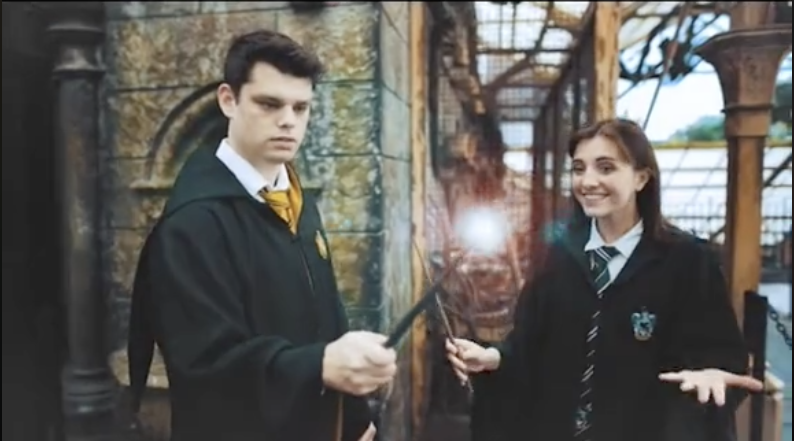 The couple holding their wands