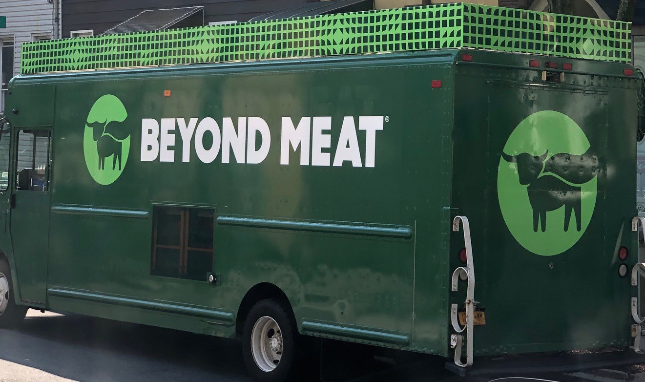 a green truck that says &quot;beyond meat&quot;