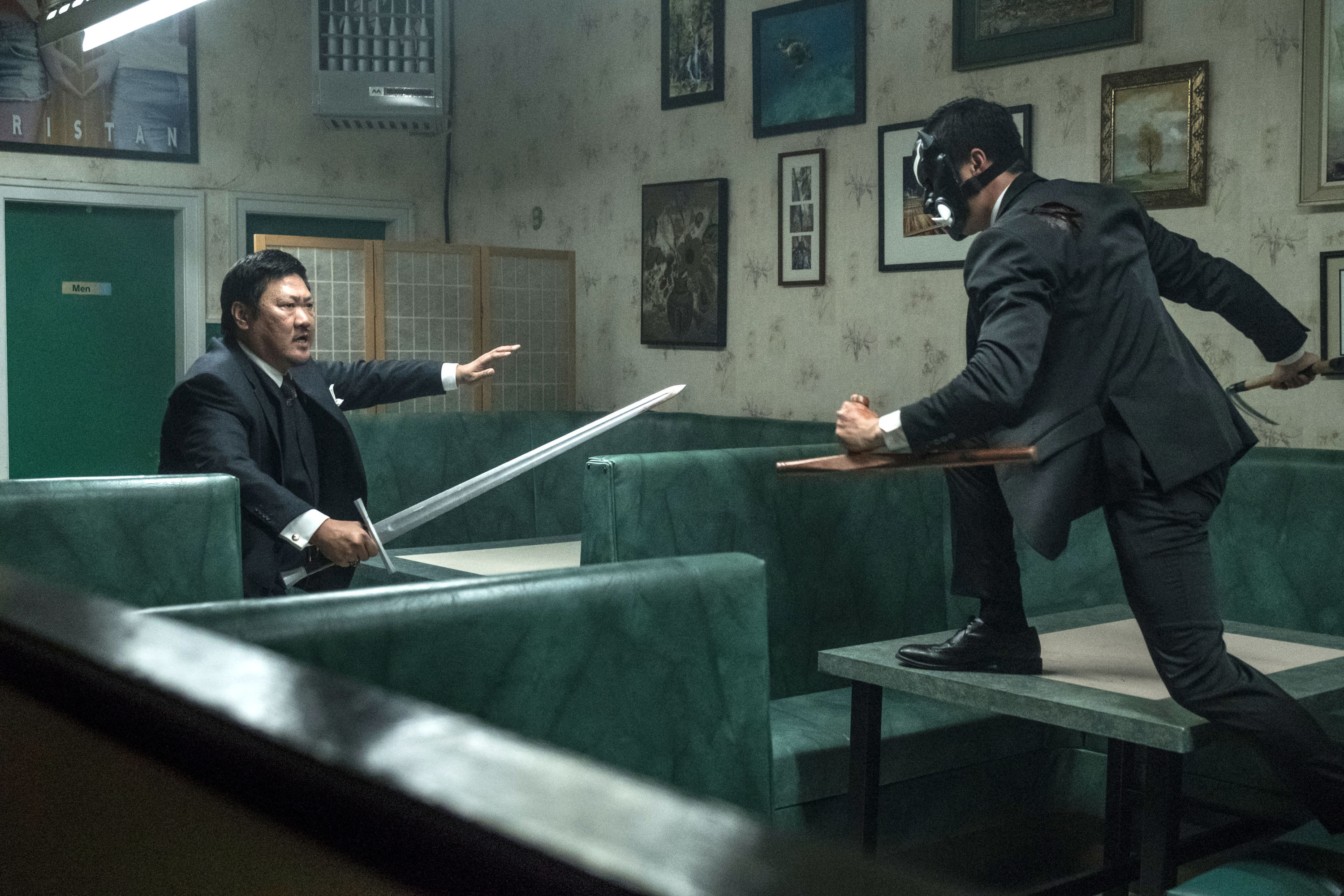 Benedict Wong swordfights with a masked assailant