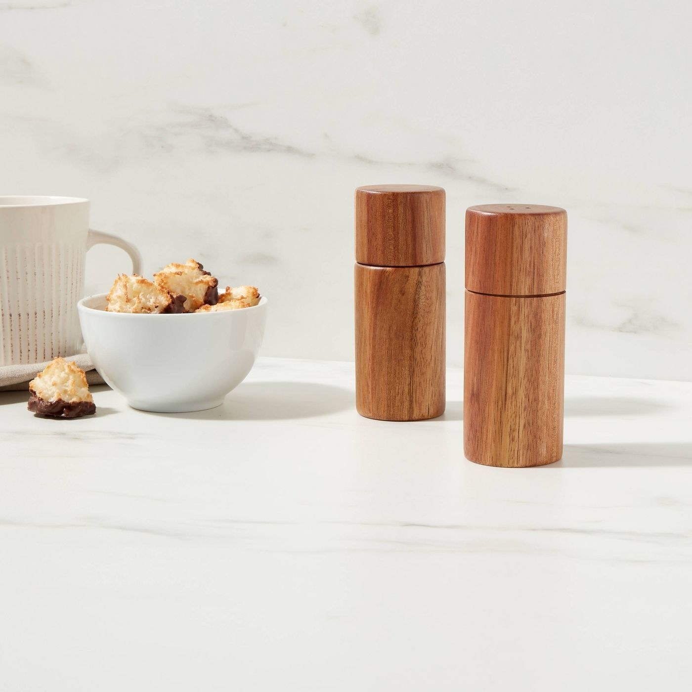 two matching wood salt and pepper shakers