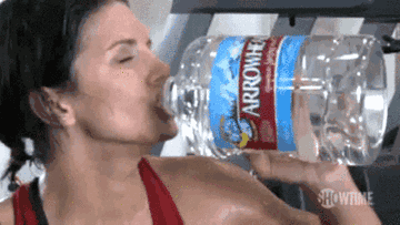 Woman drinks a lot of water