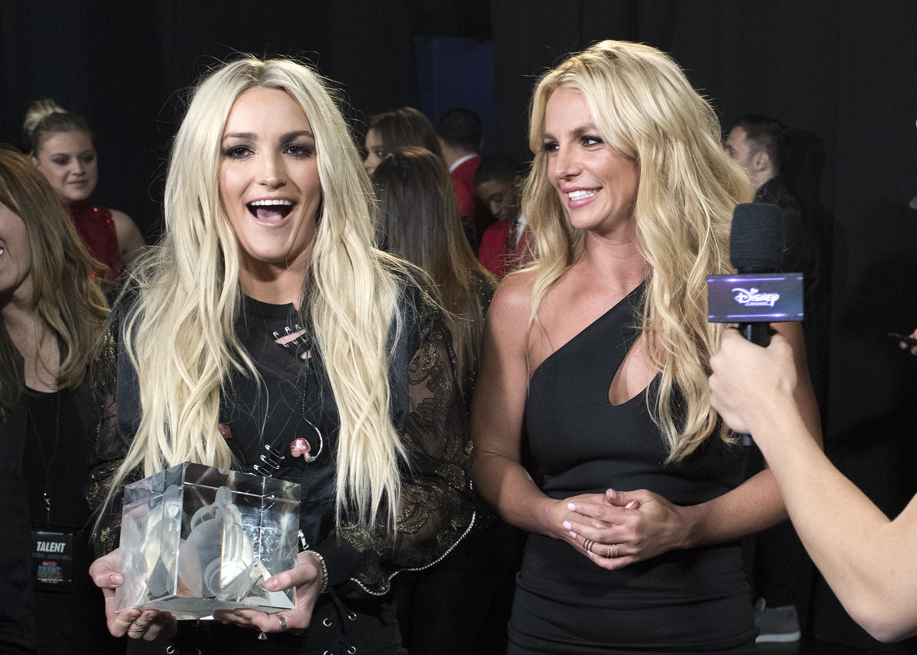 Jamie holds an award to present to Britney