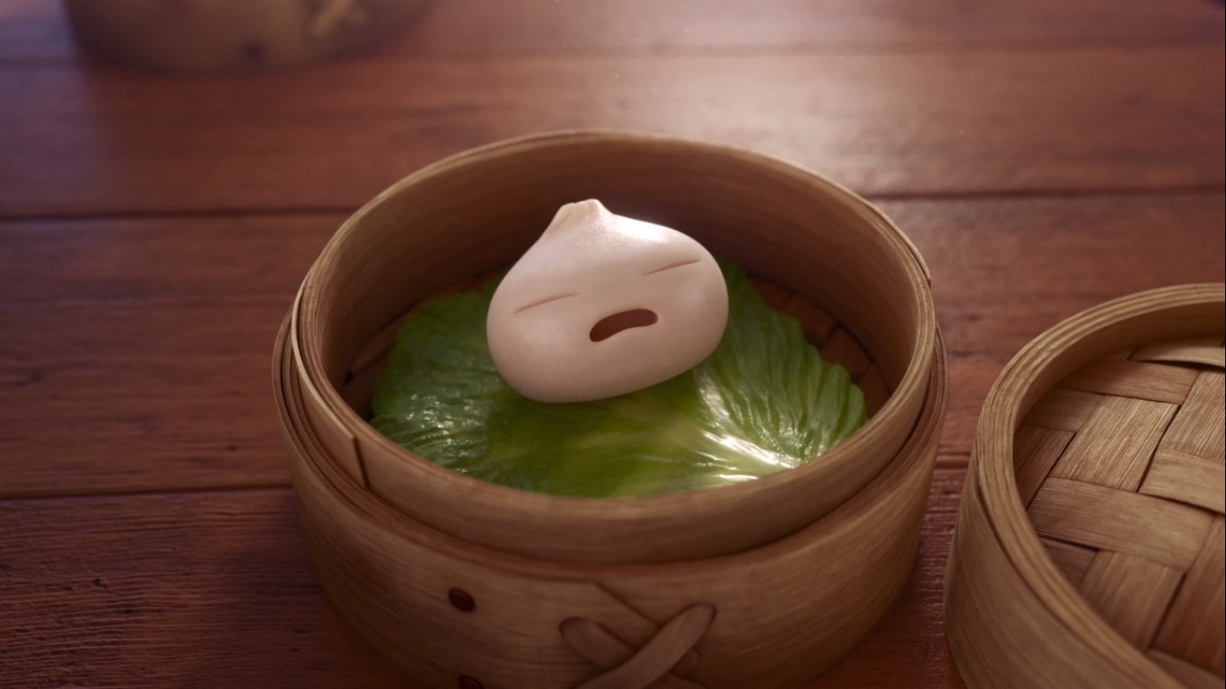 A dumpling with a face crying in a steam basket