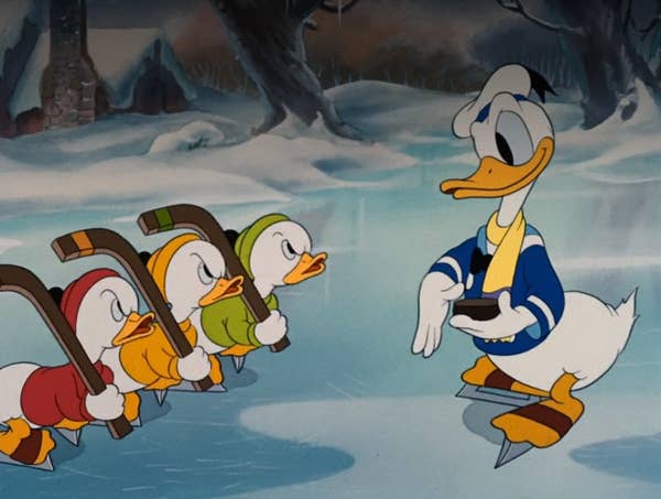 Donald Duck plays hockey against Huey, Dewey, and Louie