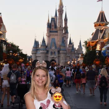 Reviewer with baby at Disney wearing matching Minnie Mouse headbands in rose gold