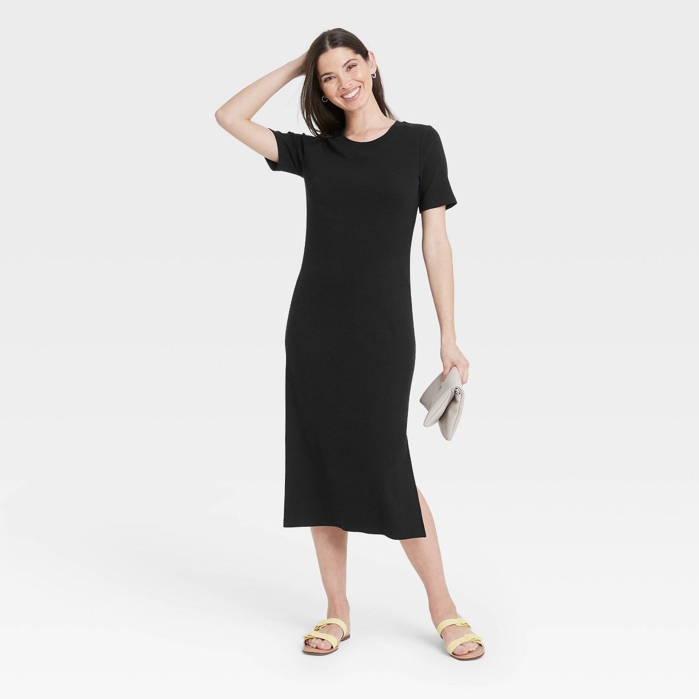 A model wearing a black maxi t shirt dress