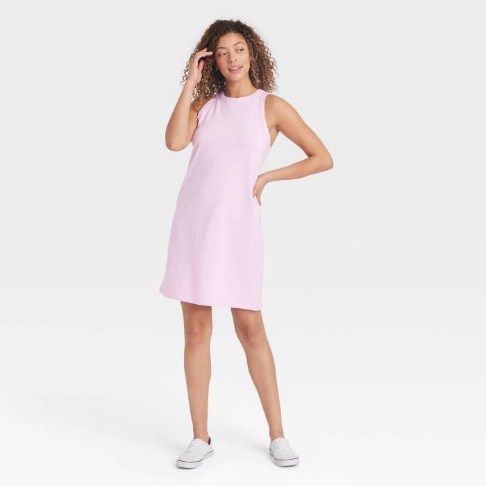 A model wearing a blush knit tank dress