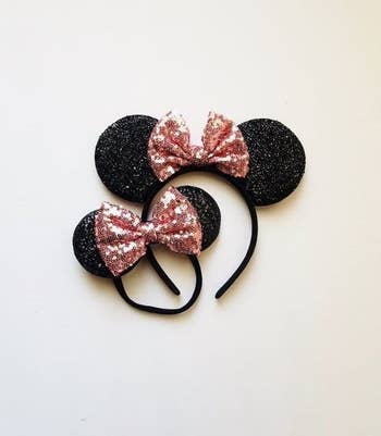 A pair of matching Minnie Mouse ear headbands in rose gold