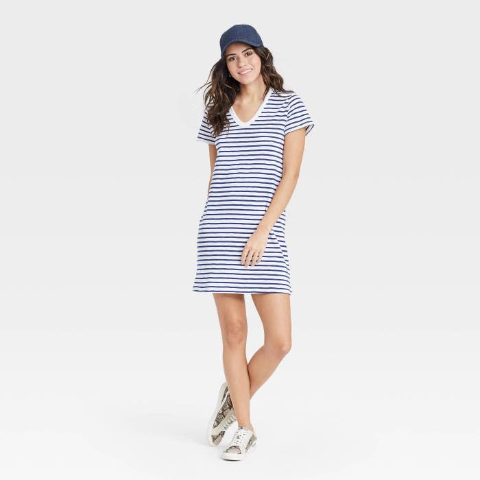 A model wearing a striped t shirt dress