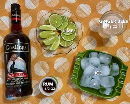 bottle of gosling&#x27;s black seal bermuda rum, 1.5 ounces rum, ice, lime, 6 ounces ginger beer