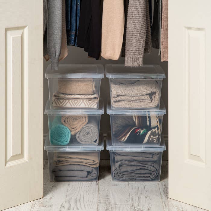 The set of six clear plastic storage boxes