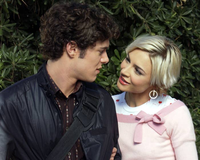 Samaire and Adam's characters look into each other's eyes