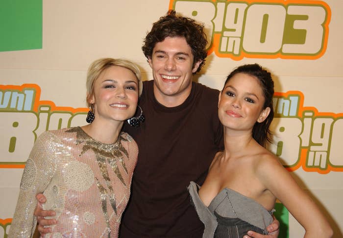 Adam poses between Samaire and Rachel at an event