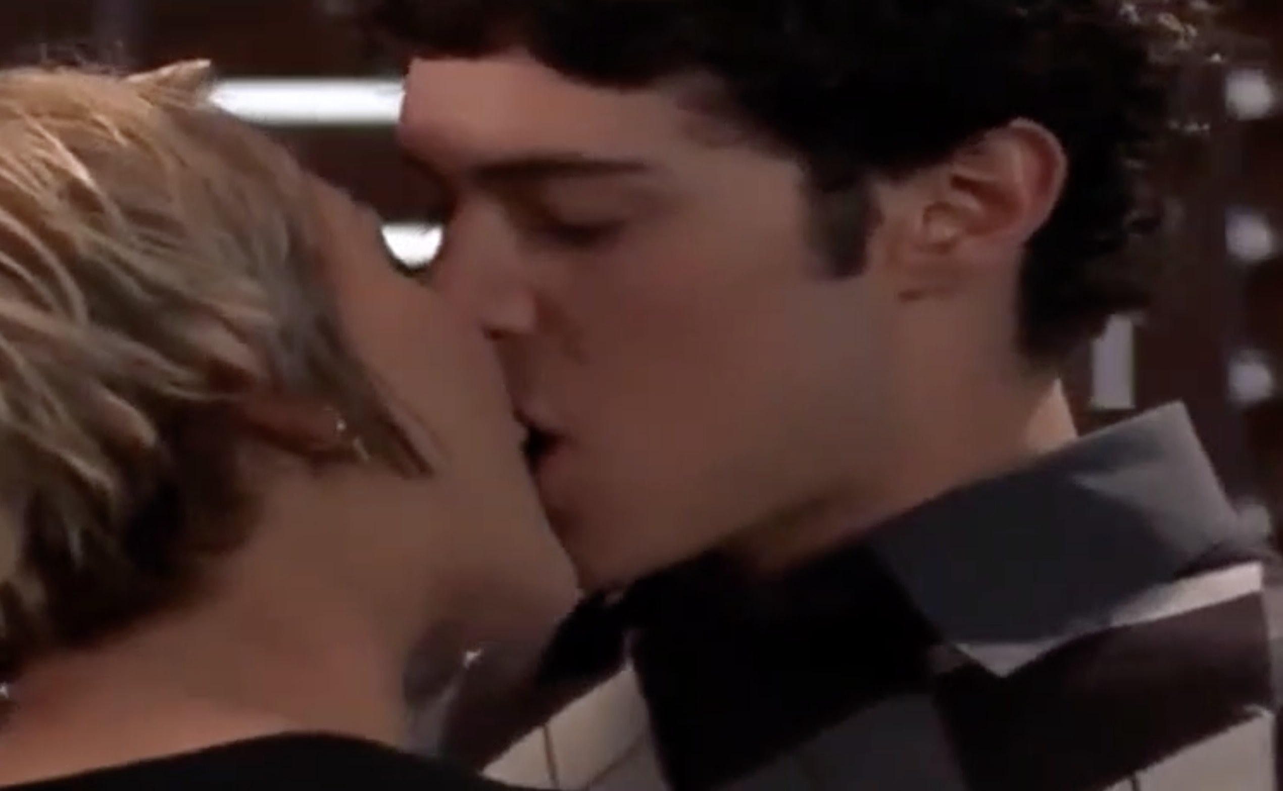 Samaire and Adam&#x27;s characters passionately kiss