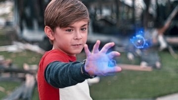 a boy uses his power to make blue projectiles