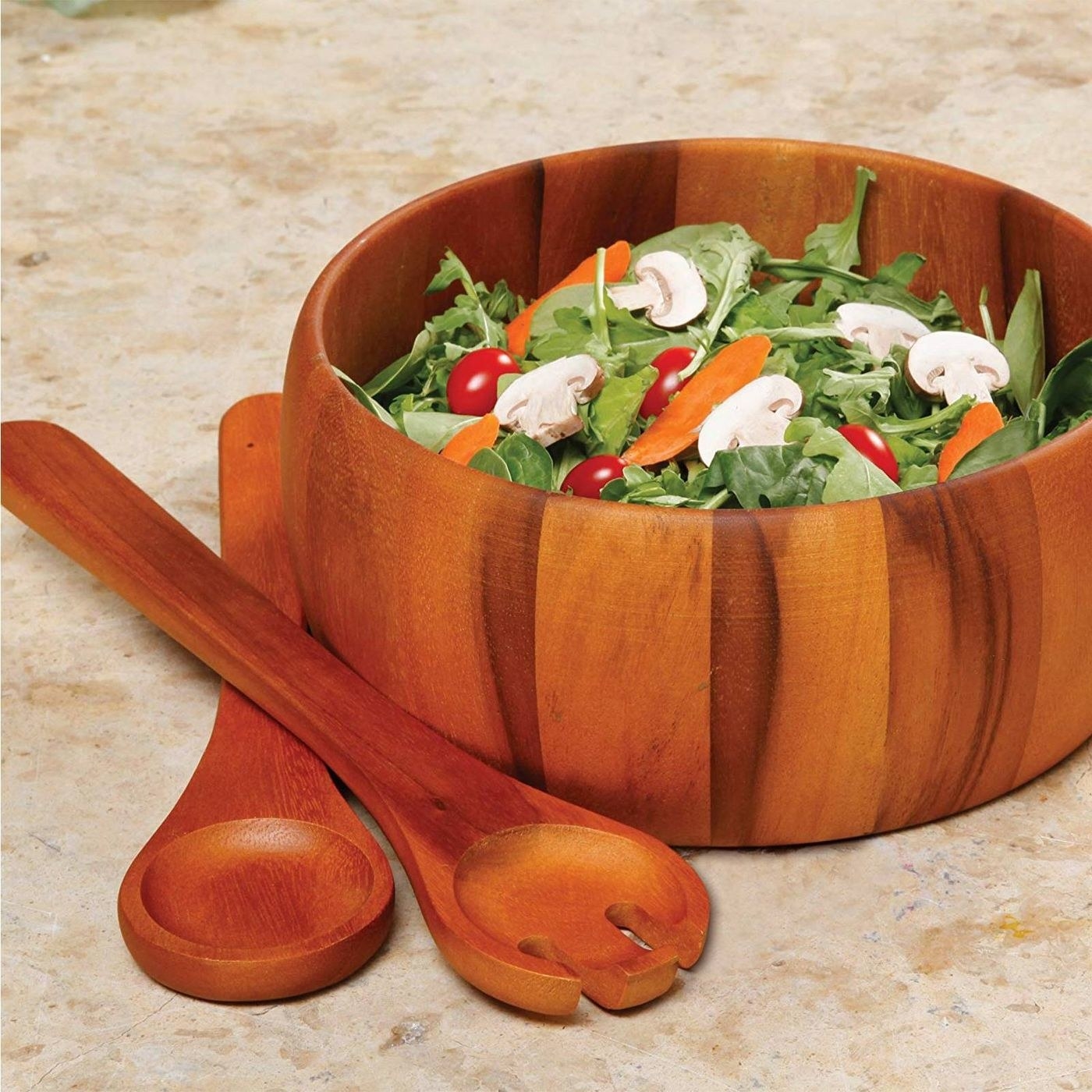 a matching set of two salad forks and a salad bowl