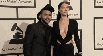 The Weeknd poses with Bella Hadid on the GRAMMYs carpet