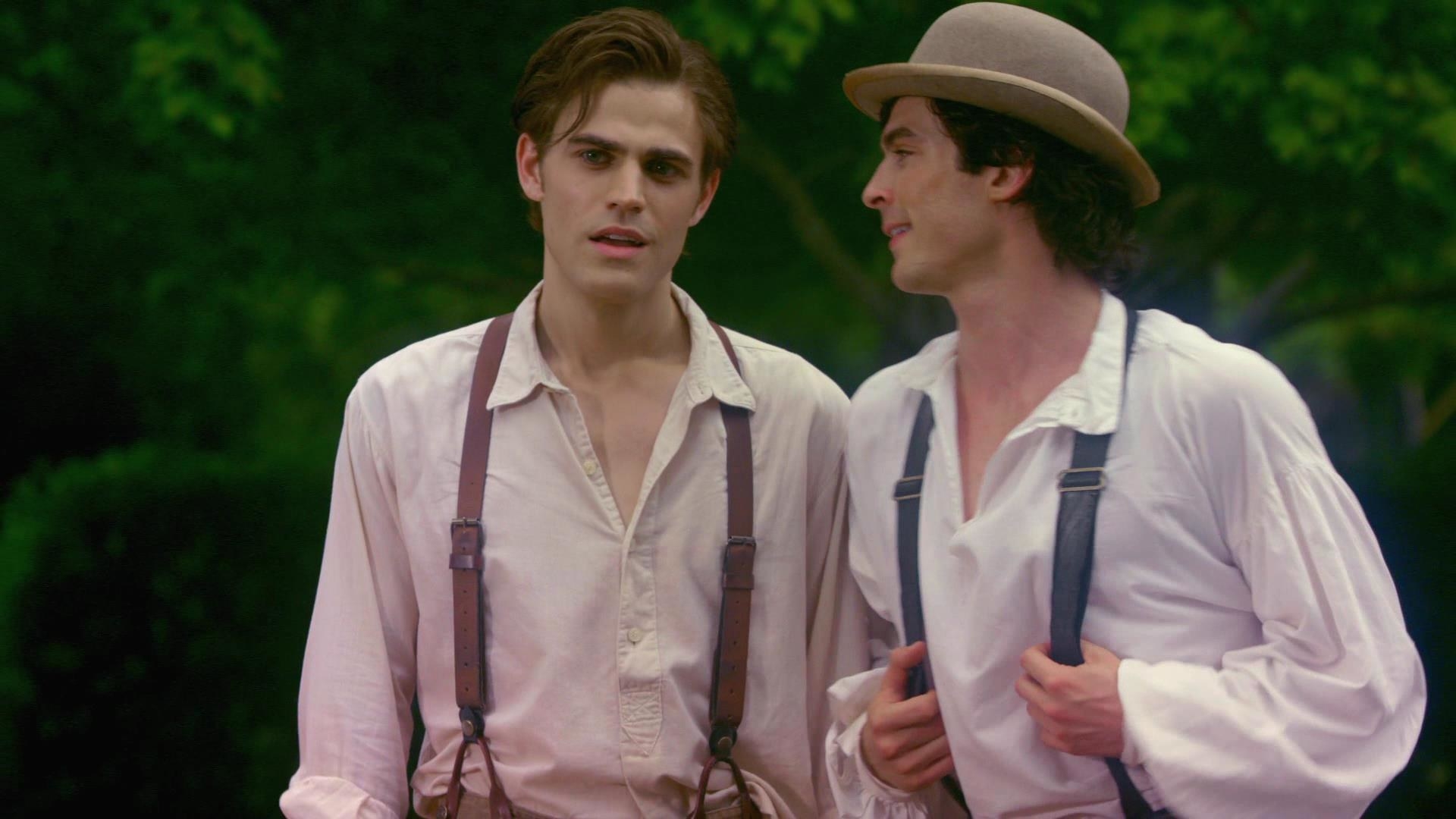 damon and stefan wear button down shirts and suspenders as if in the early 1800s