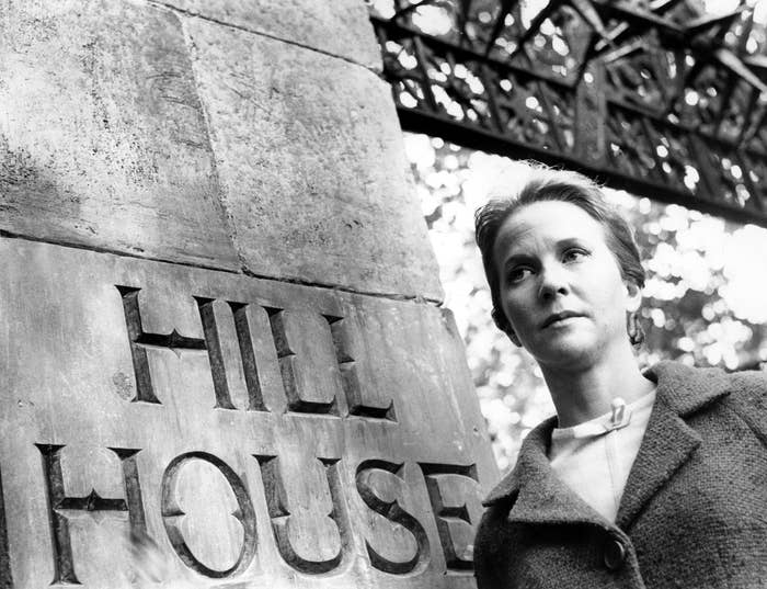 Julie Harris entering the gates of hill house where whatever walked there, walked alone