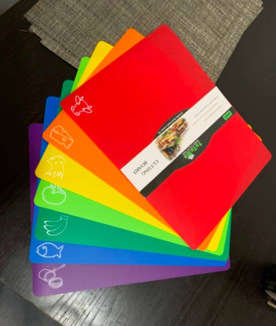 Seven color-coded mats no bigger than the traditional folder size that are light green, dark green, yellow, red, purple, orange, and blue