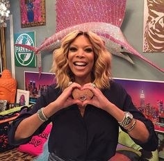 wendy williams making a heart with her hands. 