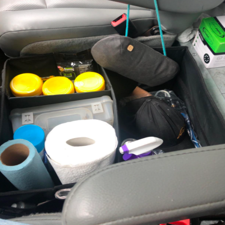 It looks like a fabric box with separators in it that fits different car items. It also has small slots on the outside of the "box" where things like brushes and scissors are stuck in.