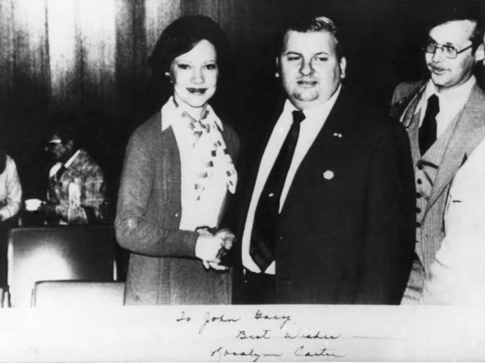 First Lady Rosalynn Carter shaking hands with serial killer John Wayne Gacy