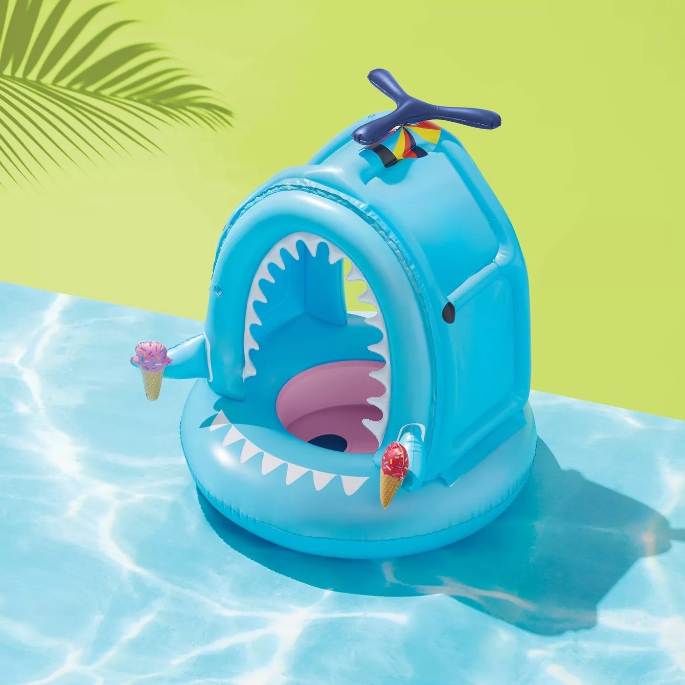 The shark pool float with a detachable canopy and ice cream cone accents on each side