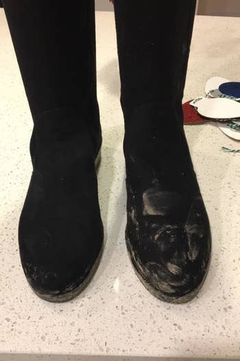 a reviewer photo of a pair of black suede boots covered in dirt