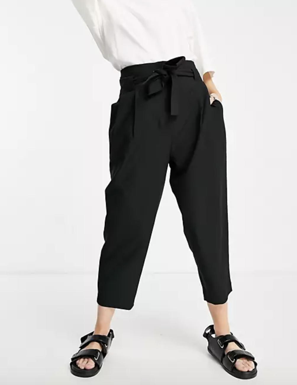 model wearing the tailored tie pants in black with black strappy sandals