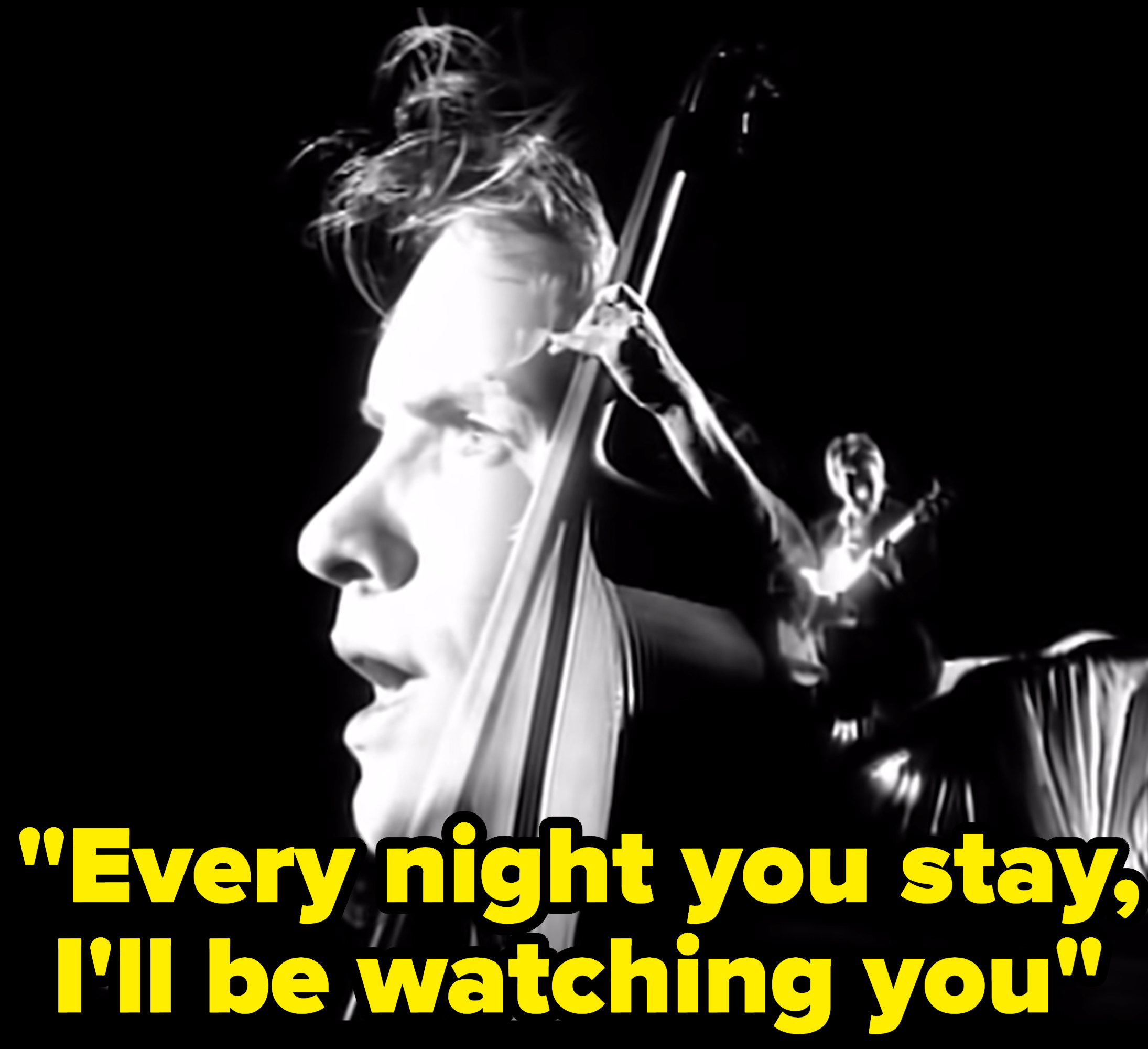 Still from the music video with the lyric: &quot;Every night you stay, I&#x27;ll be watching you&quot;