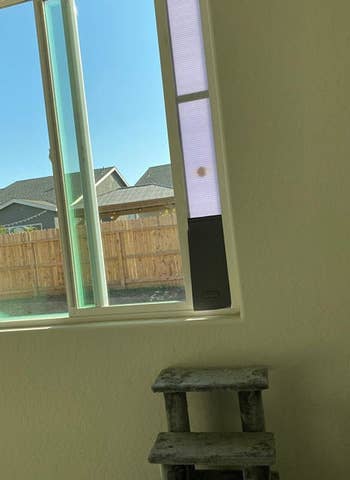 The pet door is installed on a window