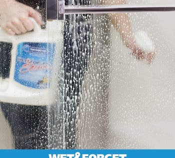 a model using the shower cleaner in a wet shower 