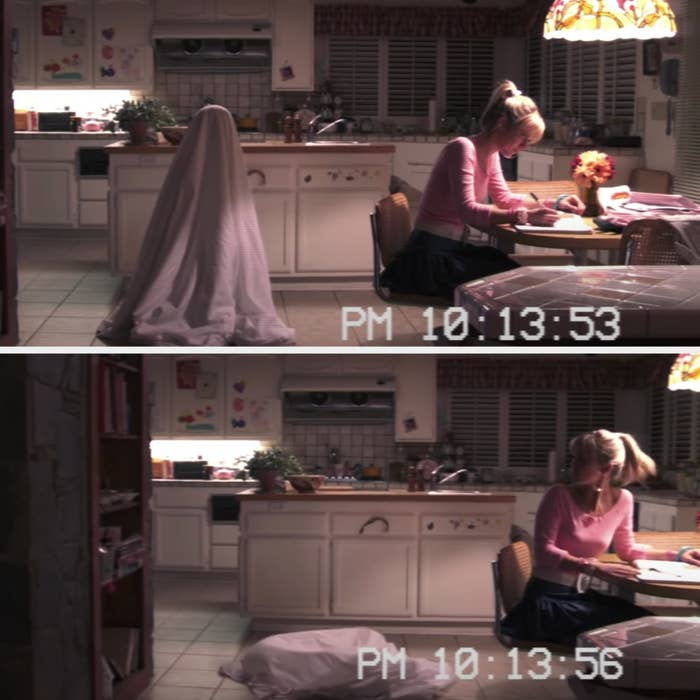 A girl writes at a kitchen table with a sheet levitating behind her, collapsing when she turns around