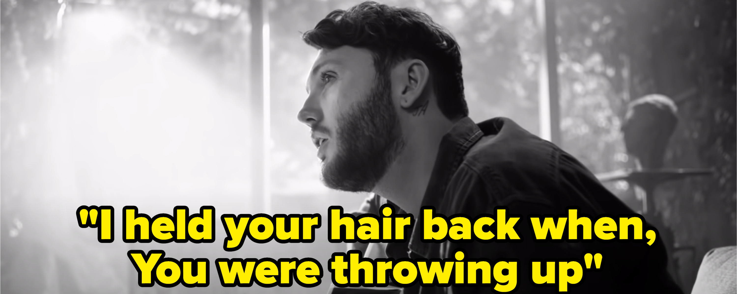 Still from the music video with the lyric: &quot;I held your hair back when you were throwing up&quot;