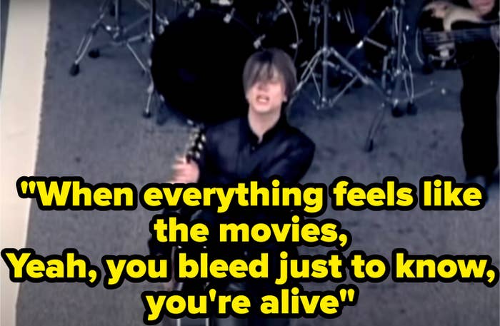 Still from the music video with the lyric: &quot;When everything feels like the movies, Yeah, you bleed just to know, you&#x27;re alive&quot;