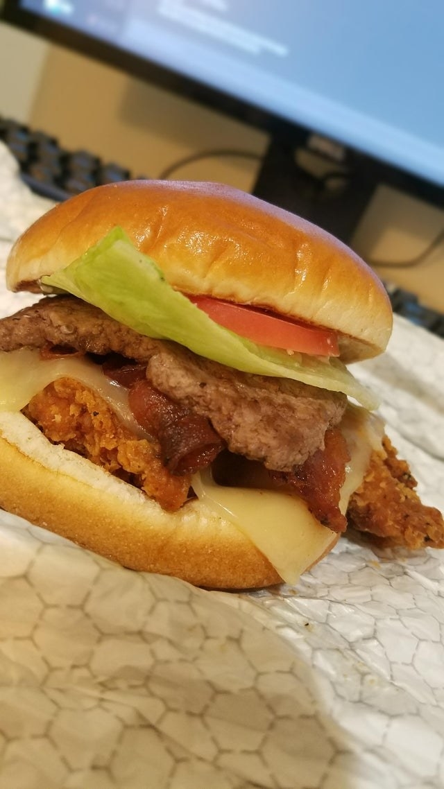 A spicy Asiago Chicken Ranch Club with a burger patty.