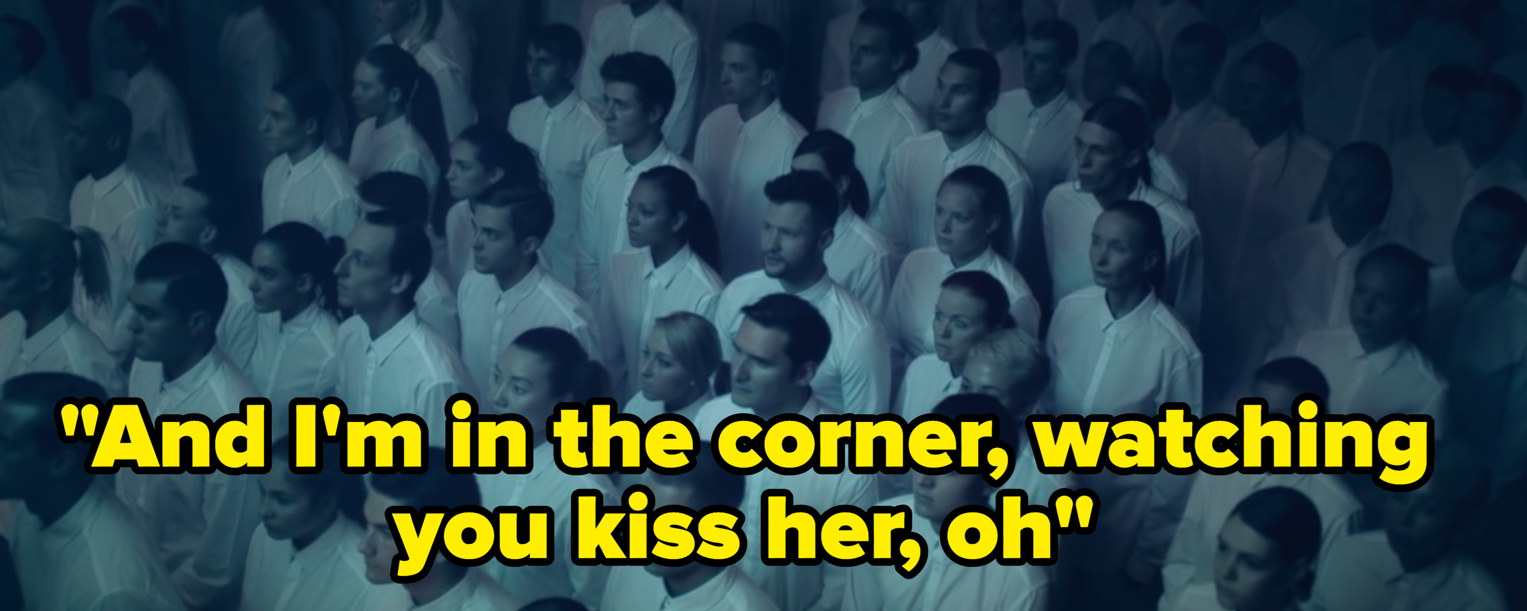 Still from the music video with the lyric: &quot;And I&#x27;m in the corner, watching you kiss her, oh&quot;