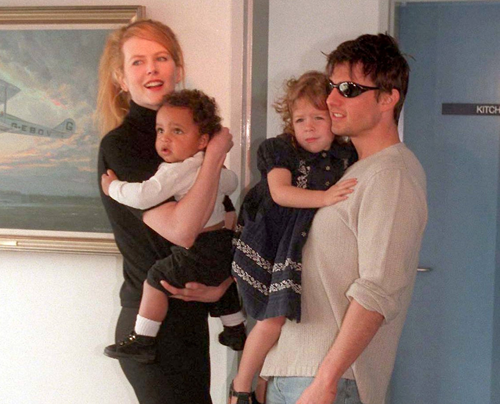An old photo of Tom and Nicole holding Bella and Connor as toddlers