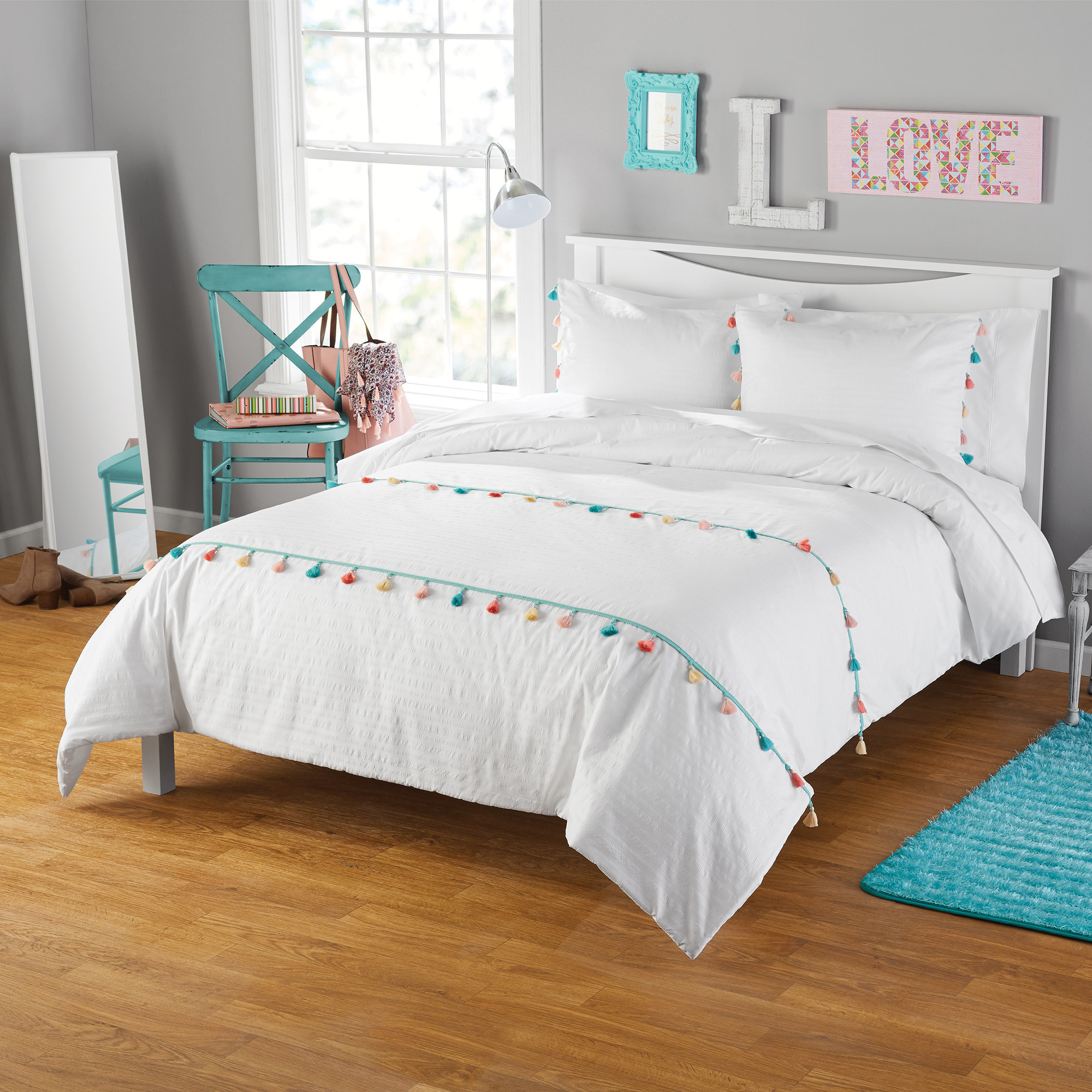 The white set with multicolor accents on a bed