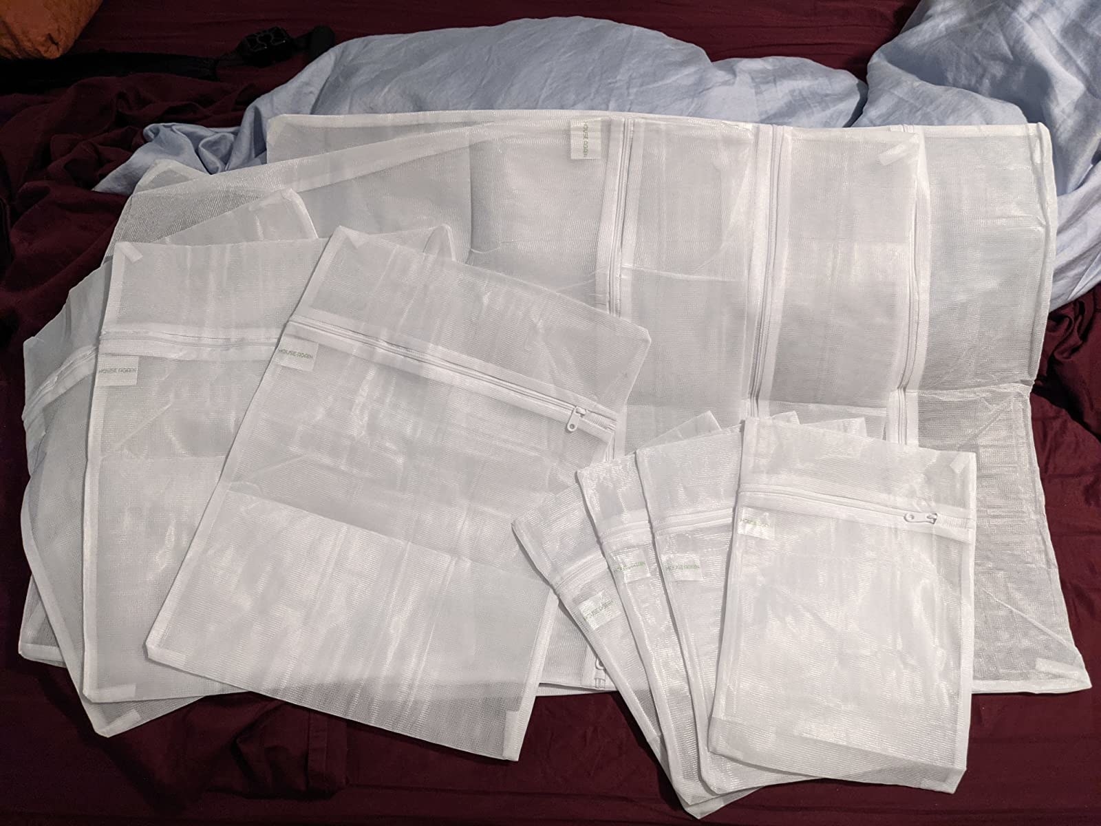 reviewer image of the multiple sizes of laundry bags