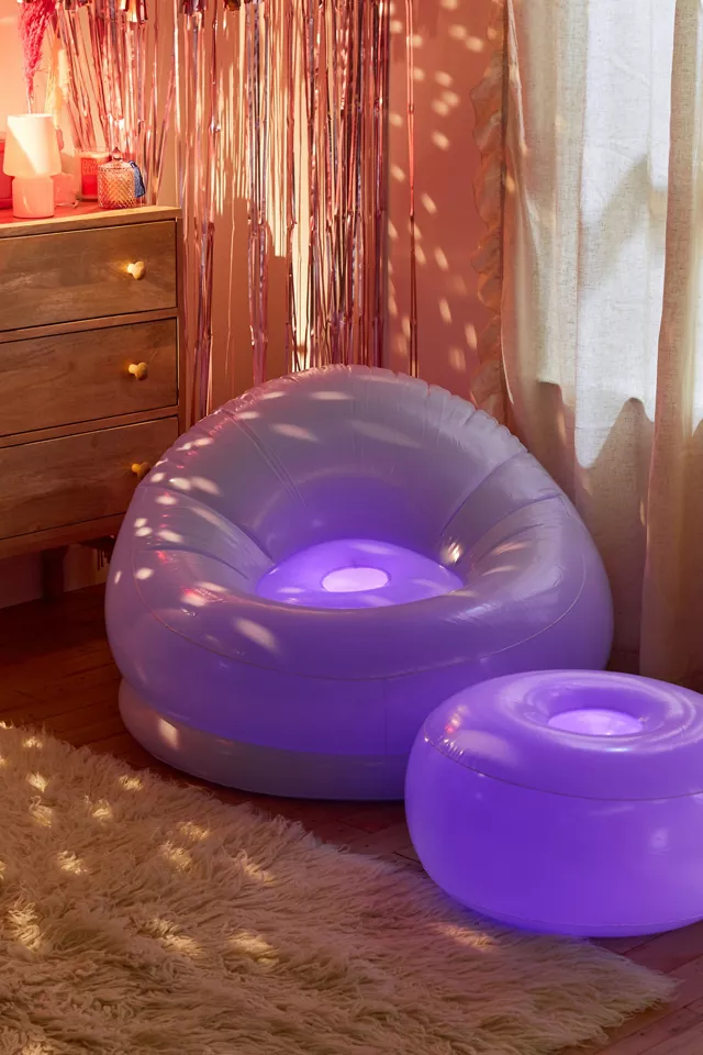 An inflatable chair and ottoman in a bedroom