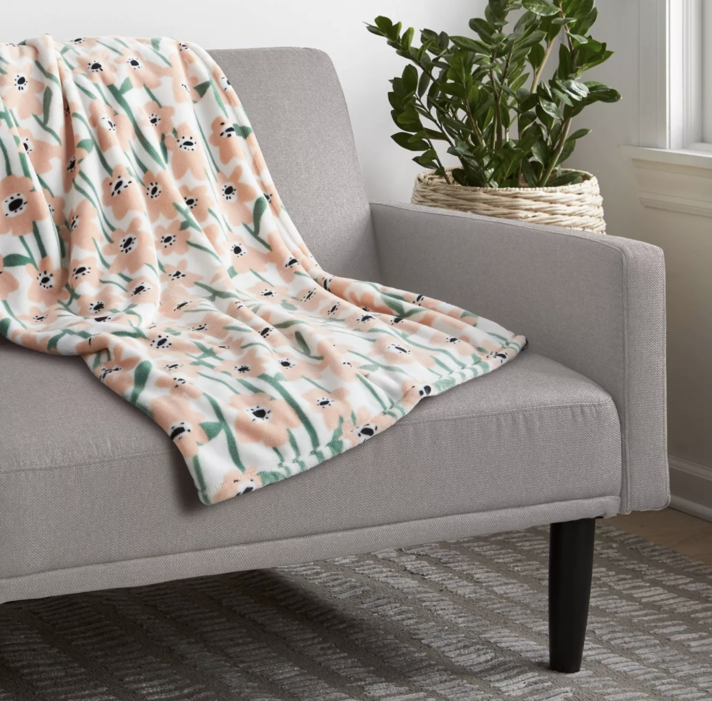 floral print throw blanket on armchair