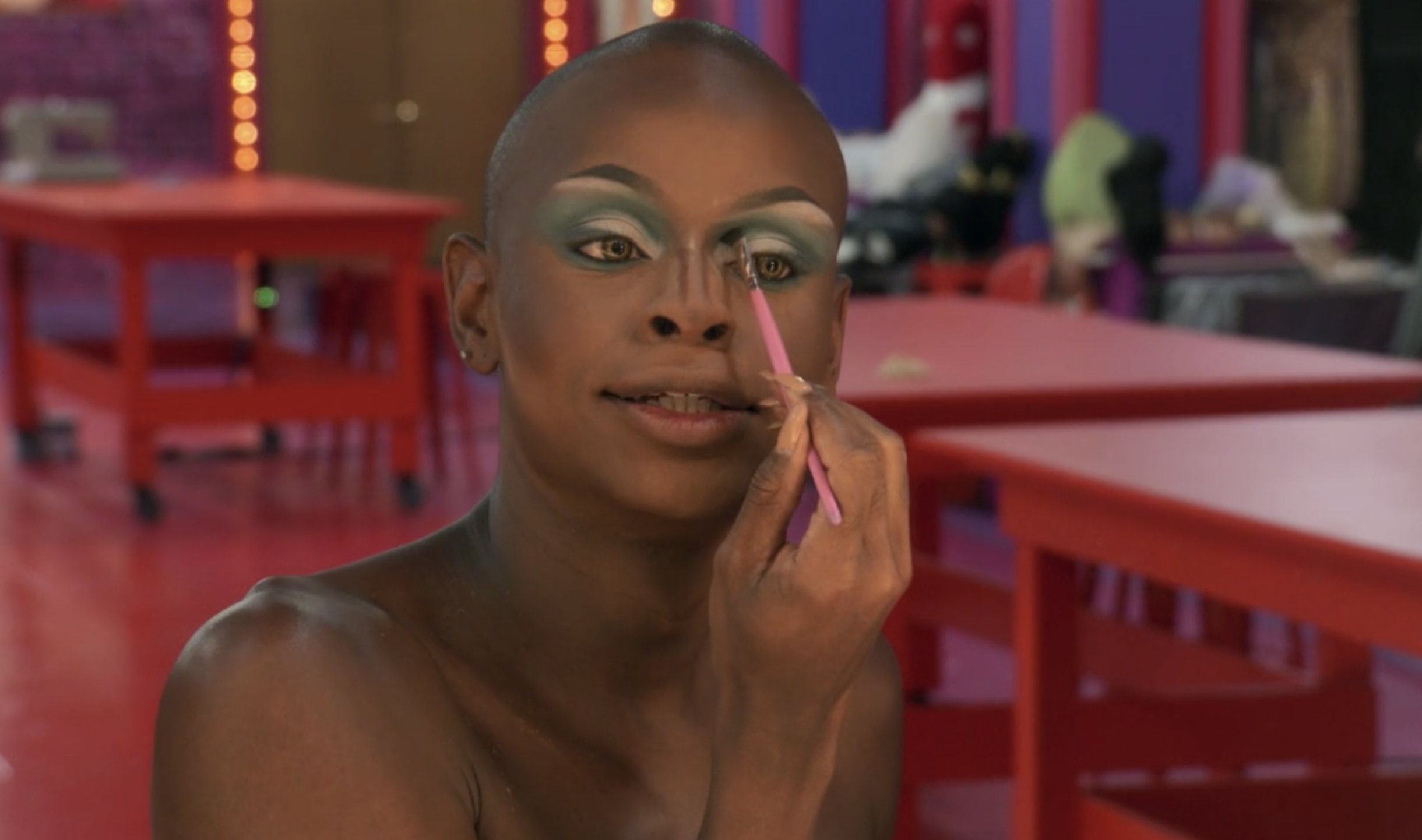 Symone doing her makeup